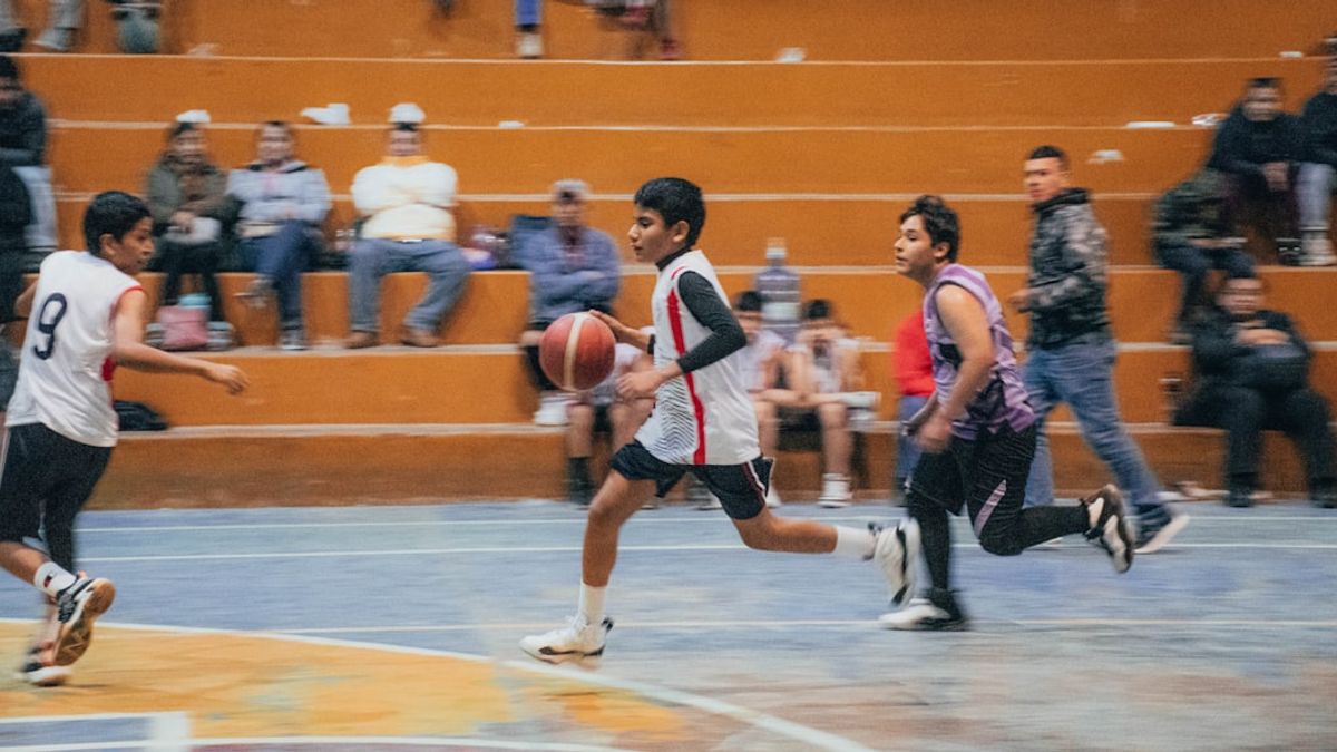 Reza Nouri collaborating with international coaches during university sports training in Iran