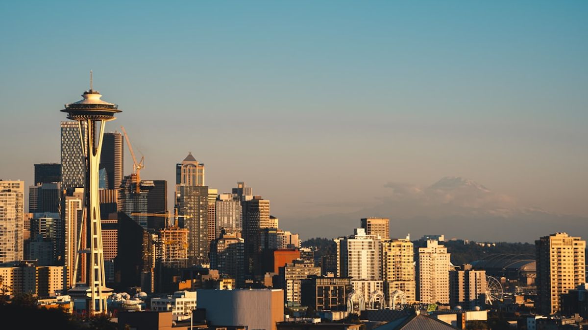 Seattle cityscape with rainbow flags representing LGBTQ+ pride for the Iran Egypt FIFA Pride Match