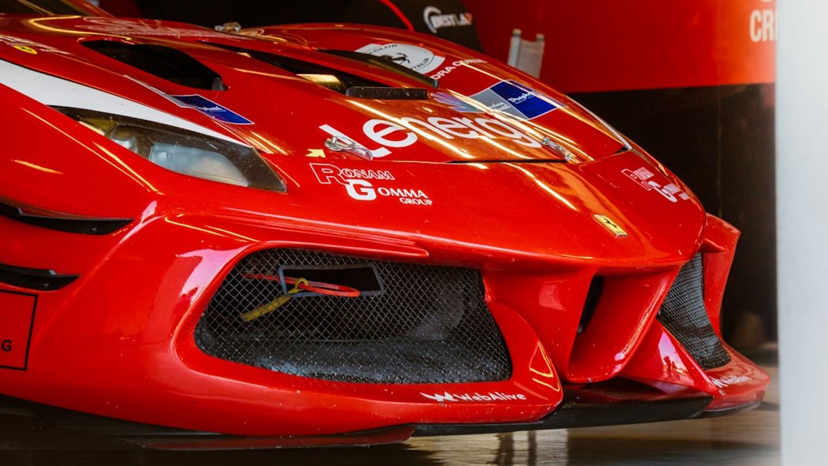 Ferrari SF-26 Formula 1 car with aggressive design, driven by Lewis Hamilton in 2026