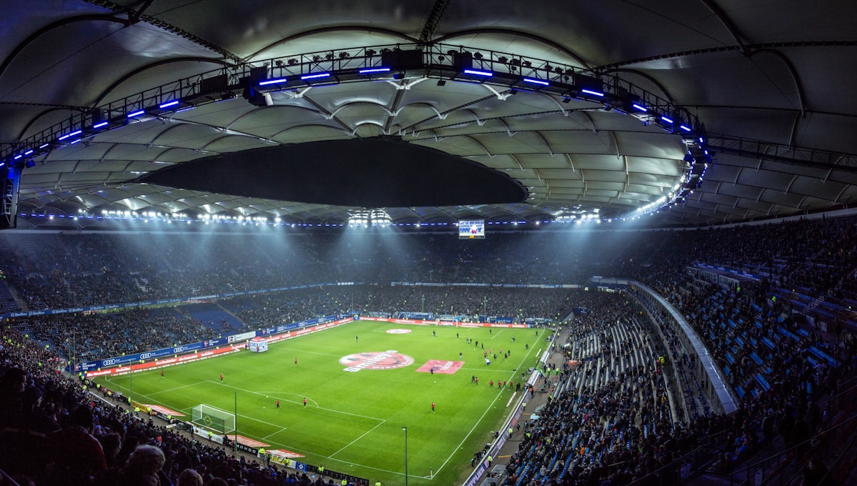 Football stadium under floodlights during a European Champions League night