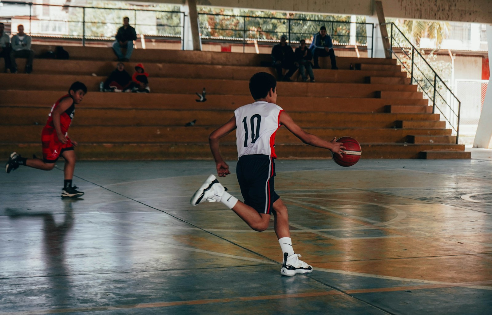 Iran basketball player attempting a layup during a FIBA Asia Cup match