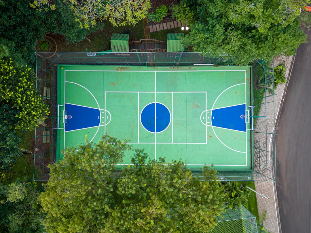 An NBA basketball court during a professional game with packed arena stands