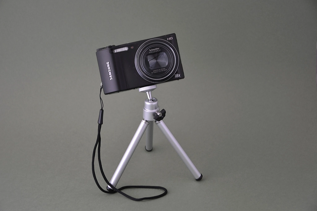 A camera mounted on a tripod overlooking a football pitch from an elevated position